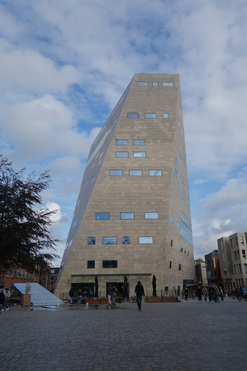 a very tall building sitting on the side of a street