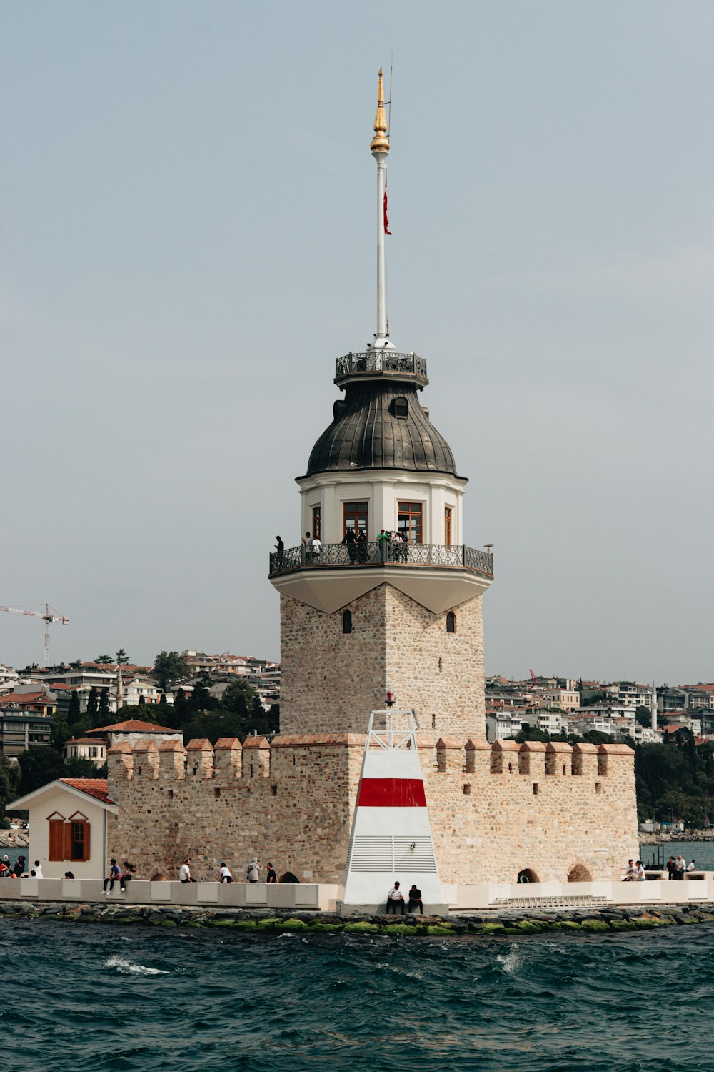 a large tower with a flag on top of it