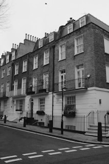 a black and white photo of a row of houses