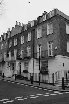 a black and white photo of a row of houses