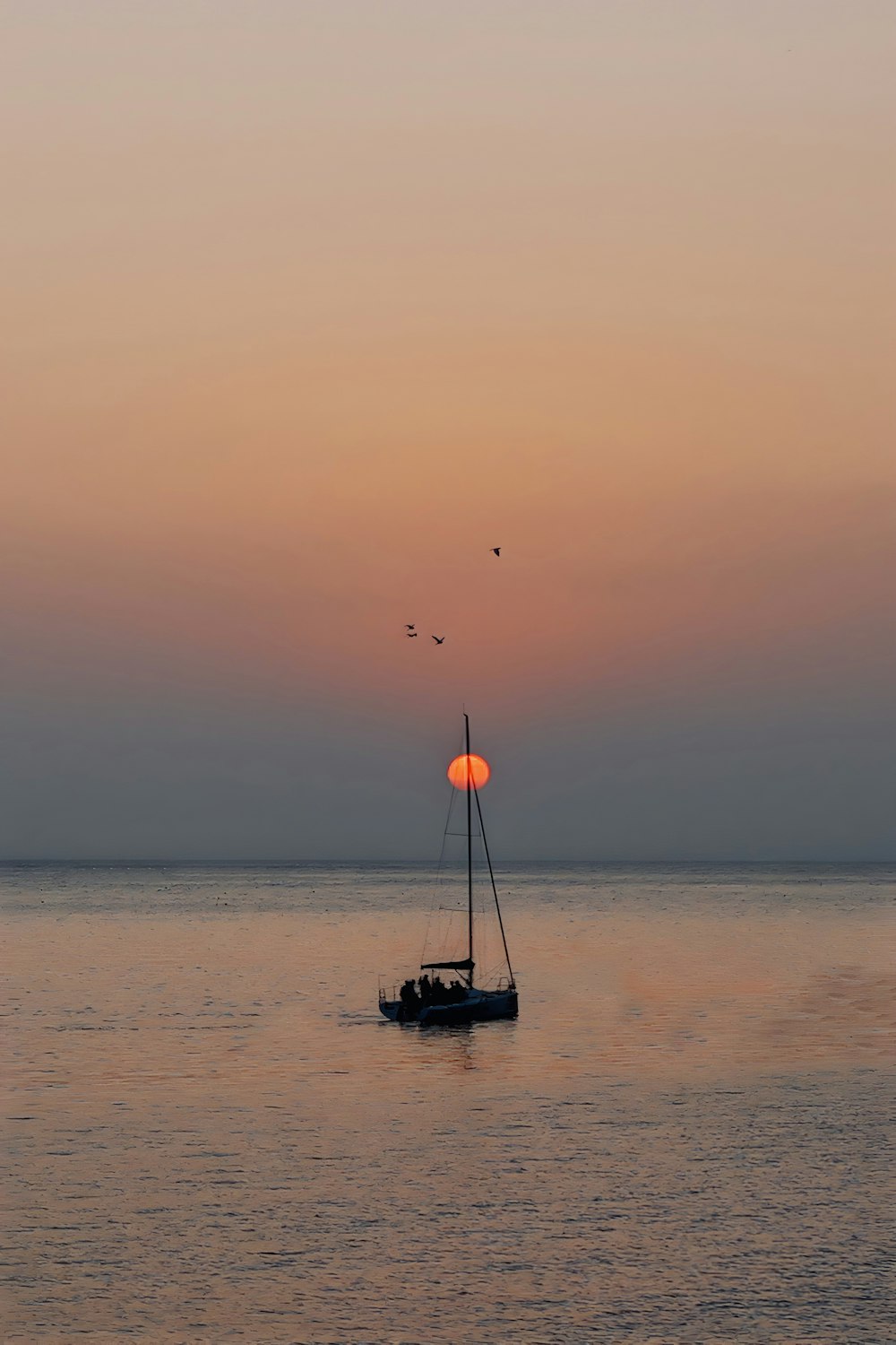 a boat floating on top of a large body of water