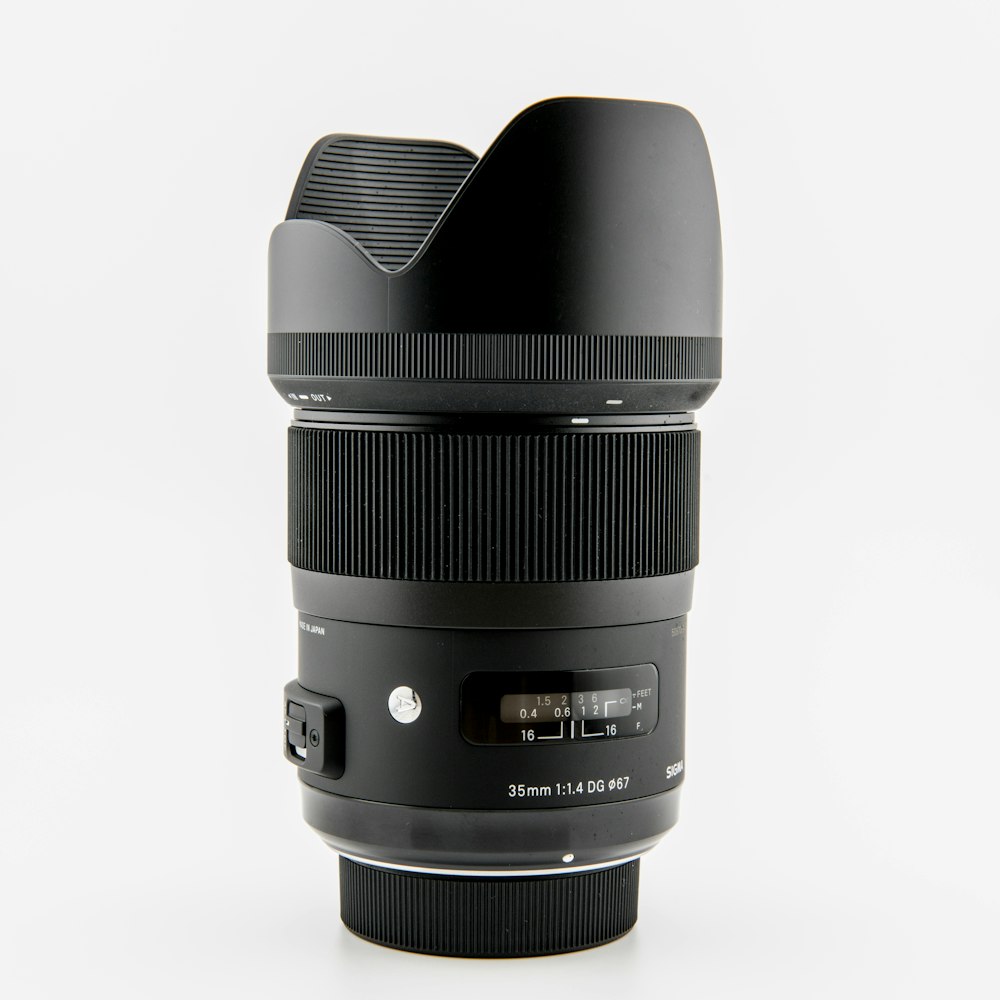 a camera lens sitting on top of a white table