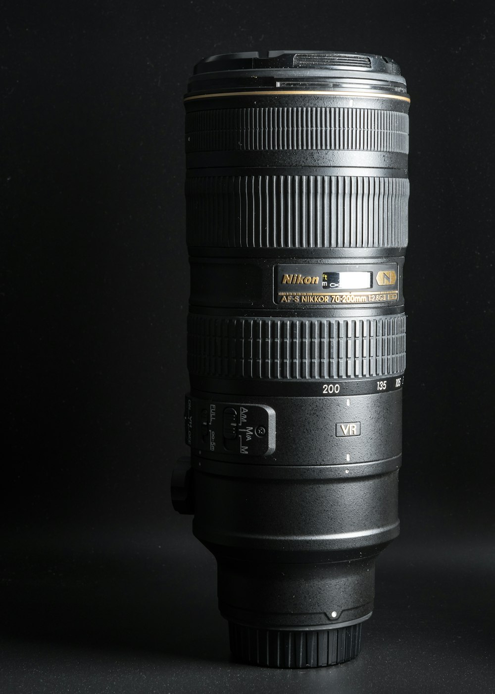 a close up of a camera lens on a black background