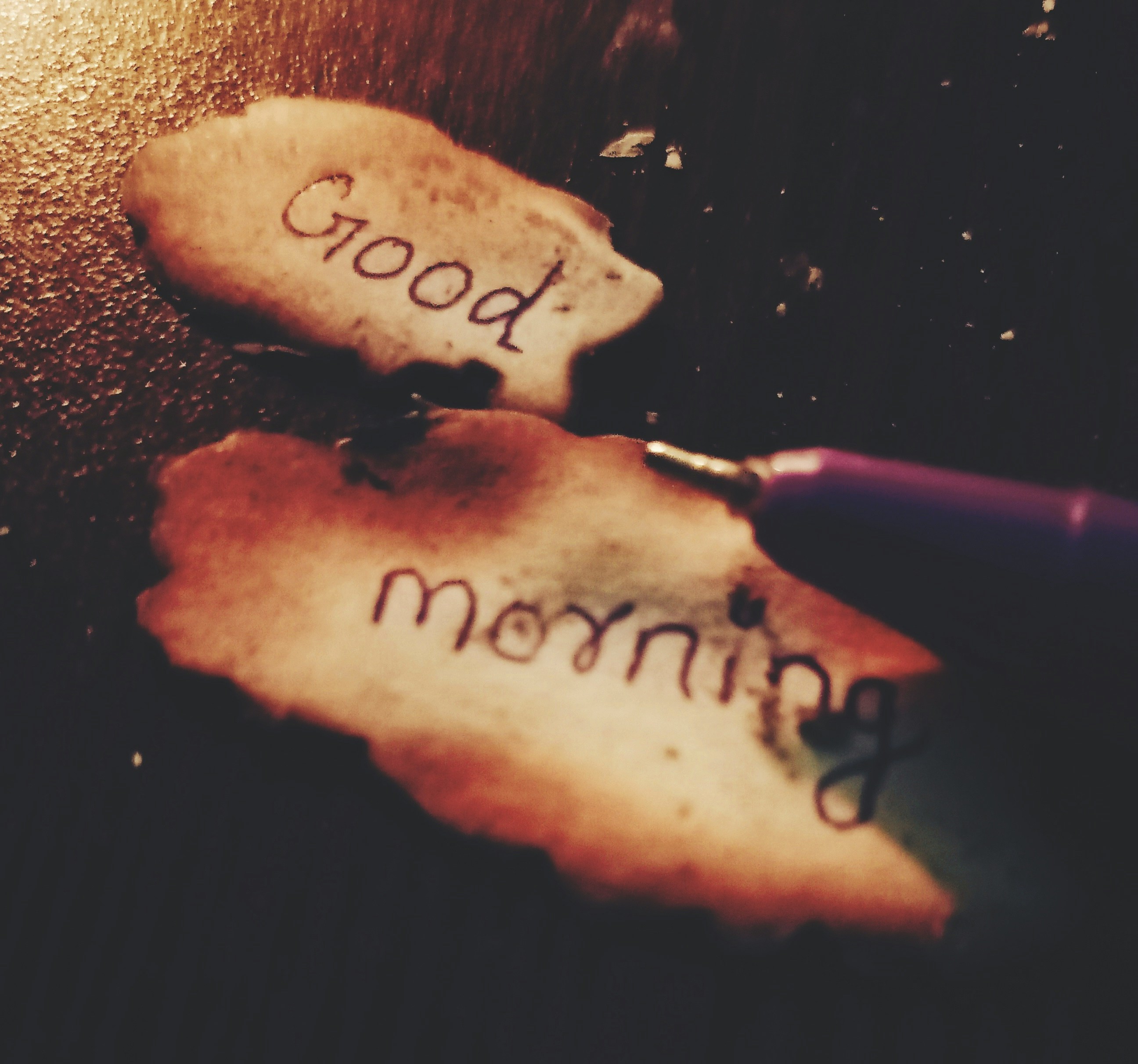 two pieces of bread with writing on them