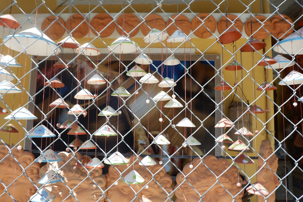 a shop window with many different types of umbrellas