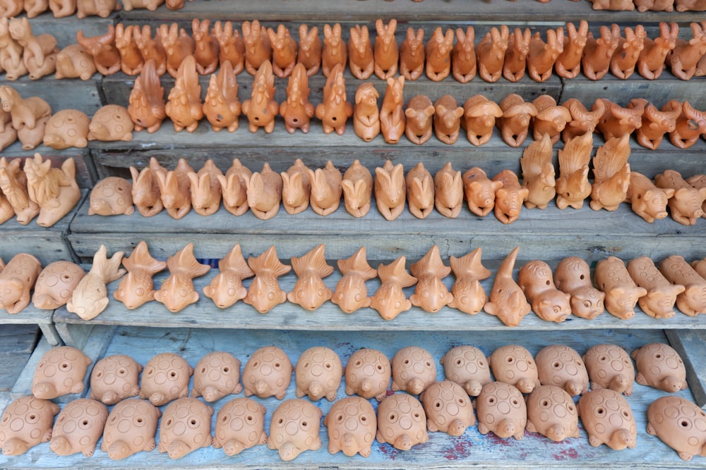 a display case filled with lots of clay animals