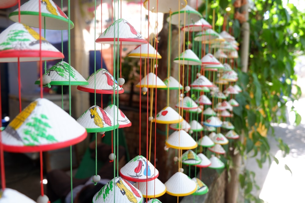 a bunch of colorful lights hanging from a tree