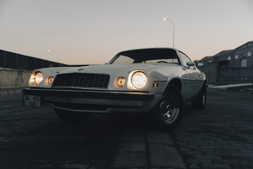 a white car parked in a parking lot