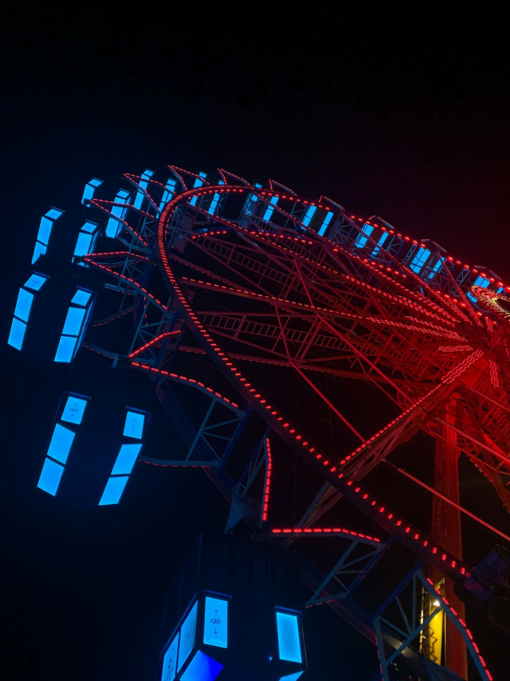 a large ferris wheel lit up at night