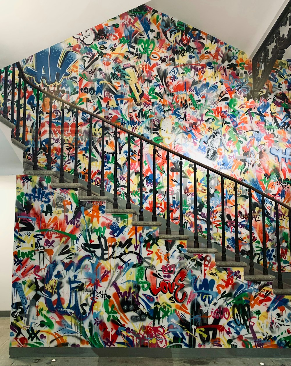 a stair case with graffiti painted on it