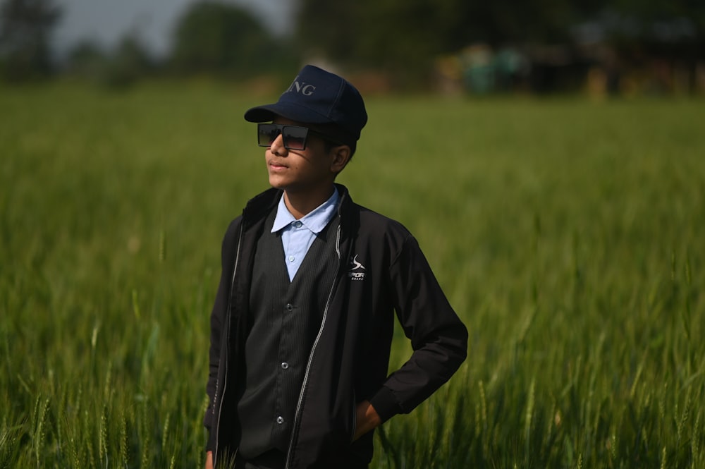 a man standing in a field of tall grass