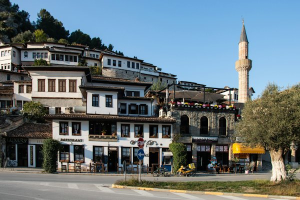 A large white building sitting on the side of a road — Berat, Albania