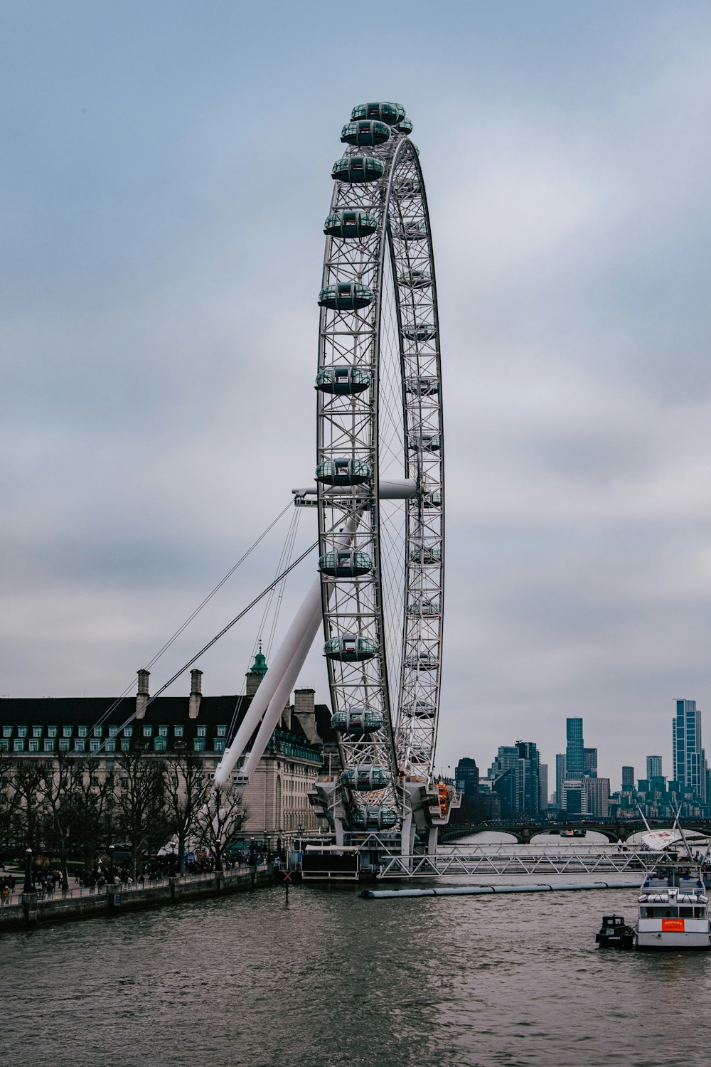 a large ferris wheel in the middle of a body of water