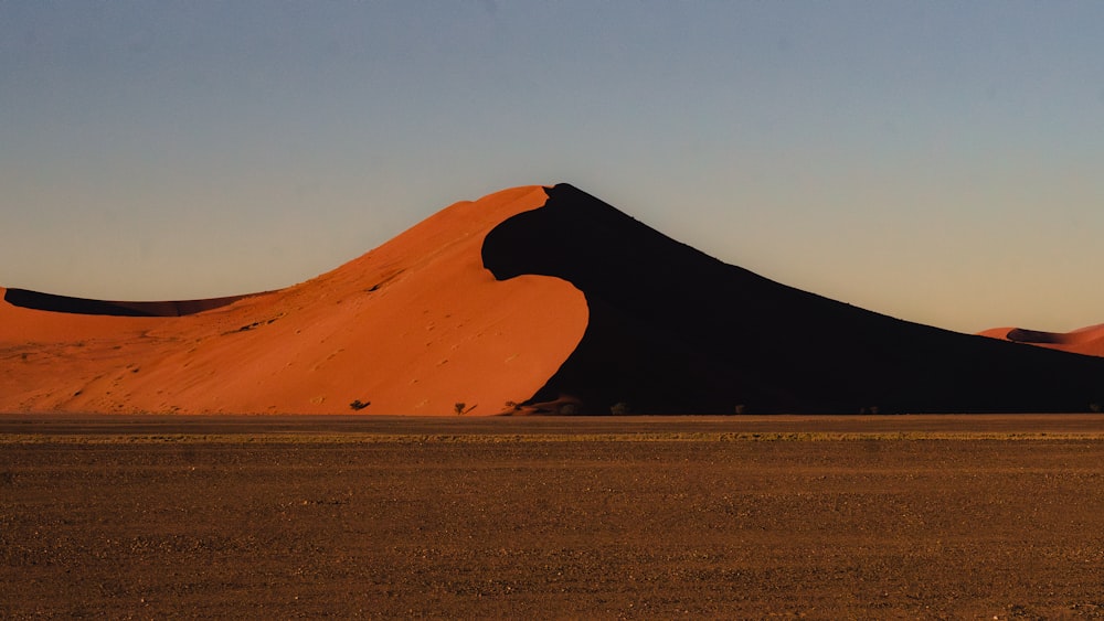 a large sand dune in the middle of a desert