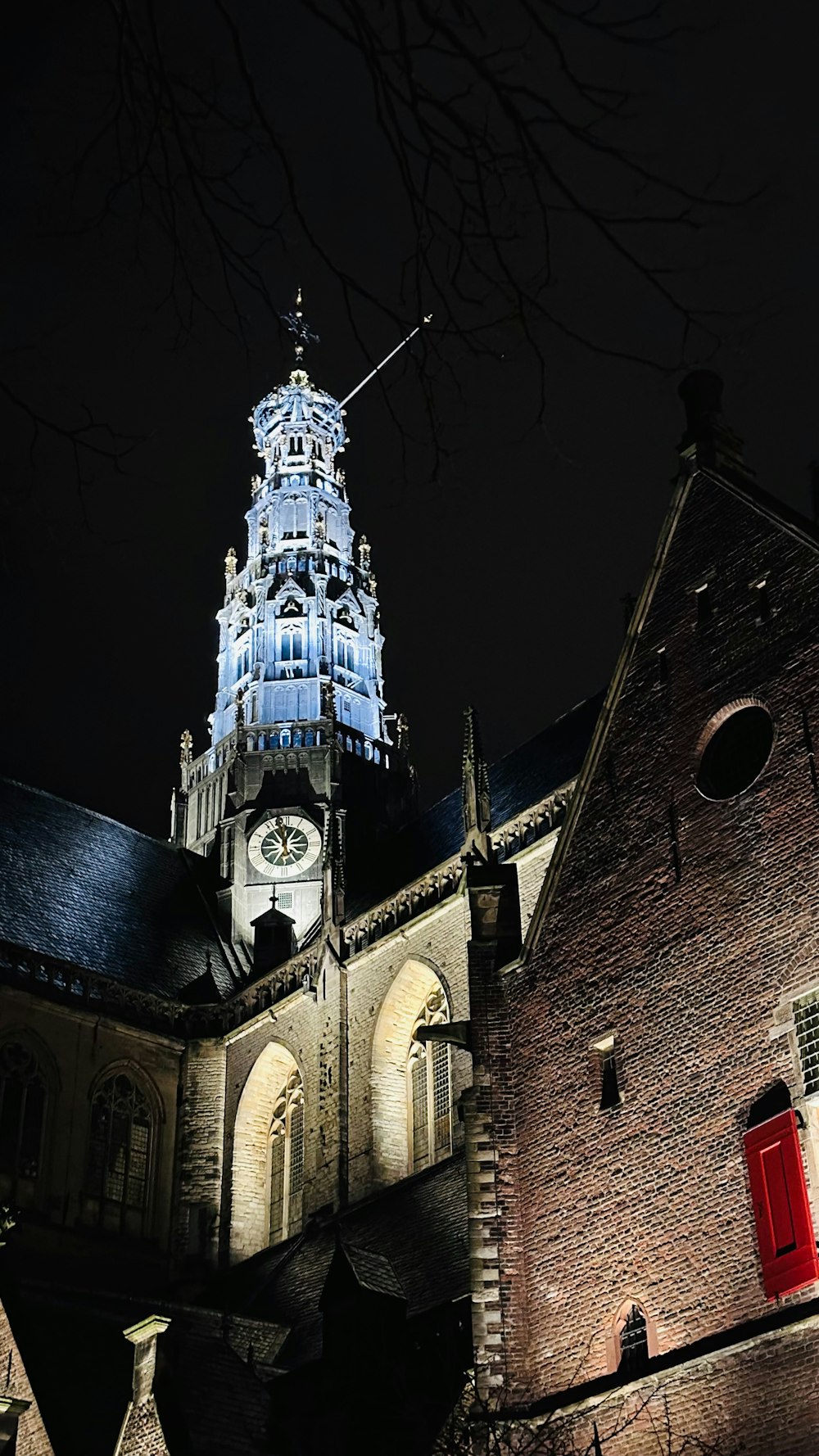 a building with a clock tower lit up at night