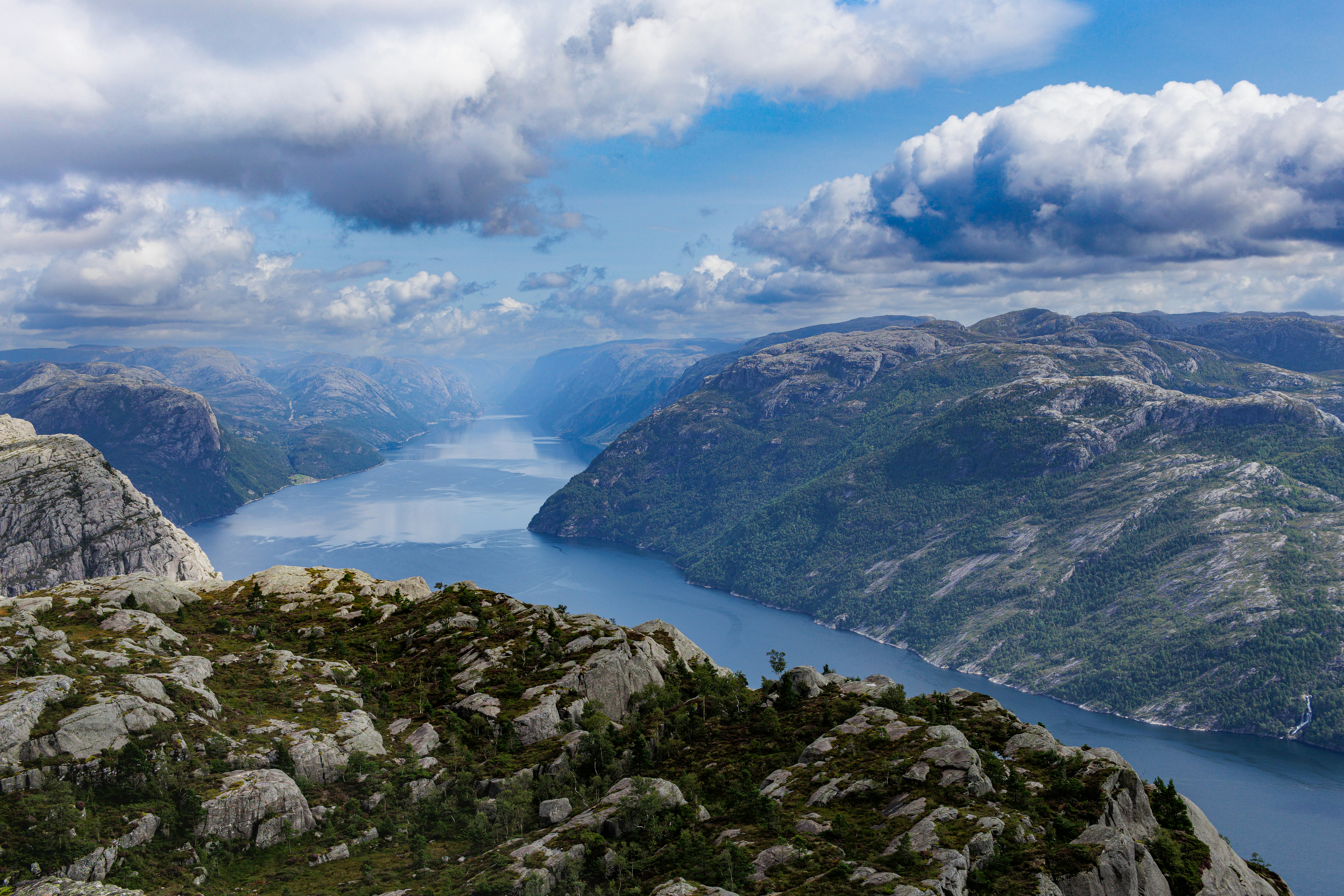 a scenic view of a body of water surrounded by mountains, Pulpit Rock in Norway. August 2023. 3x2 aspect ratio. Enjoy!