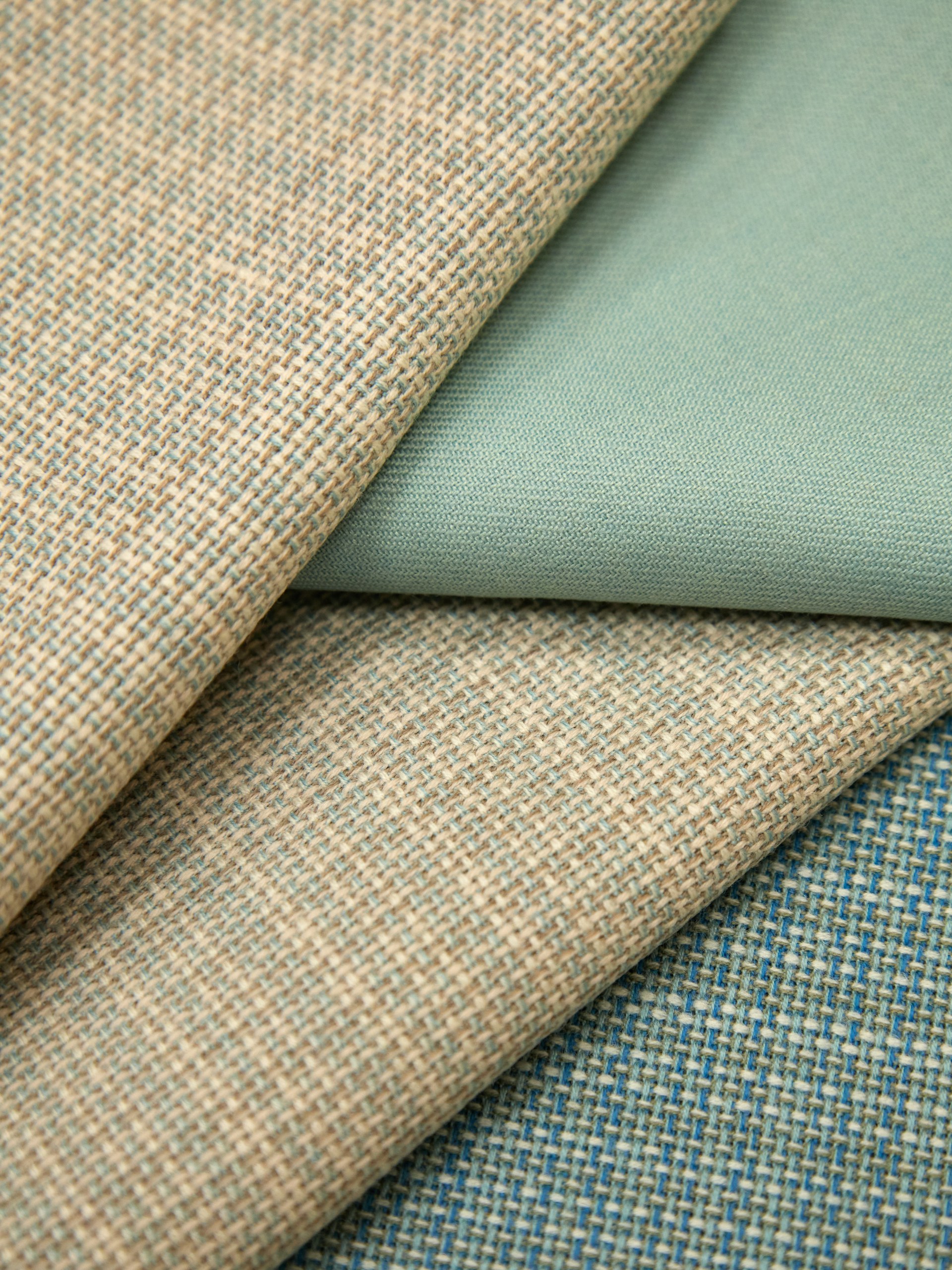 a close up of several different colors of fabric