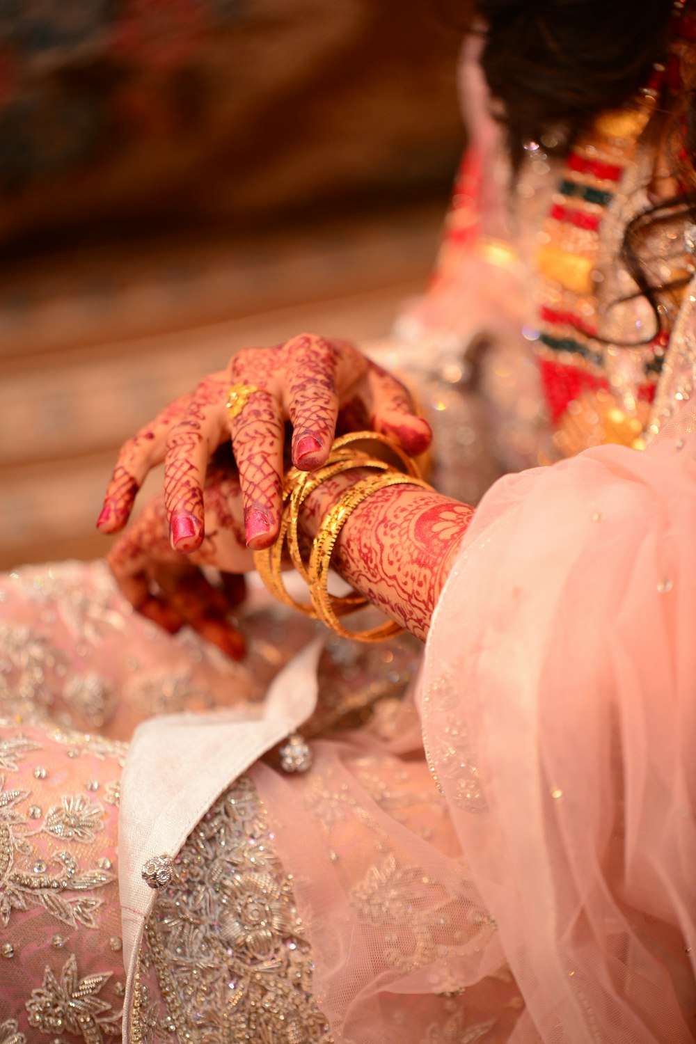 a close up of a woman's hands holding a bracelet