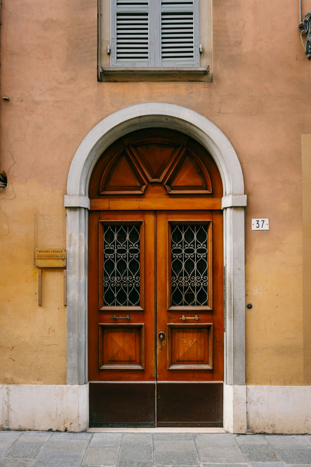 a couple of doors that are in front of a building