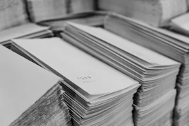 a stack of papers sitting on top of a table