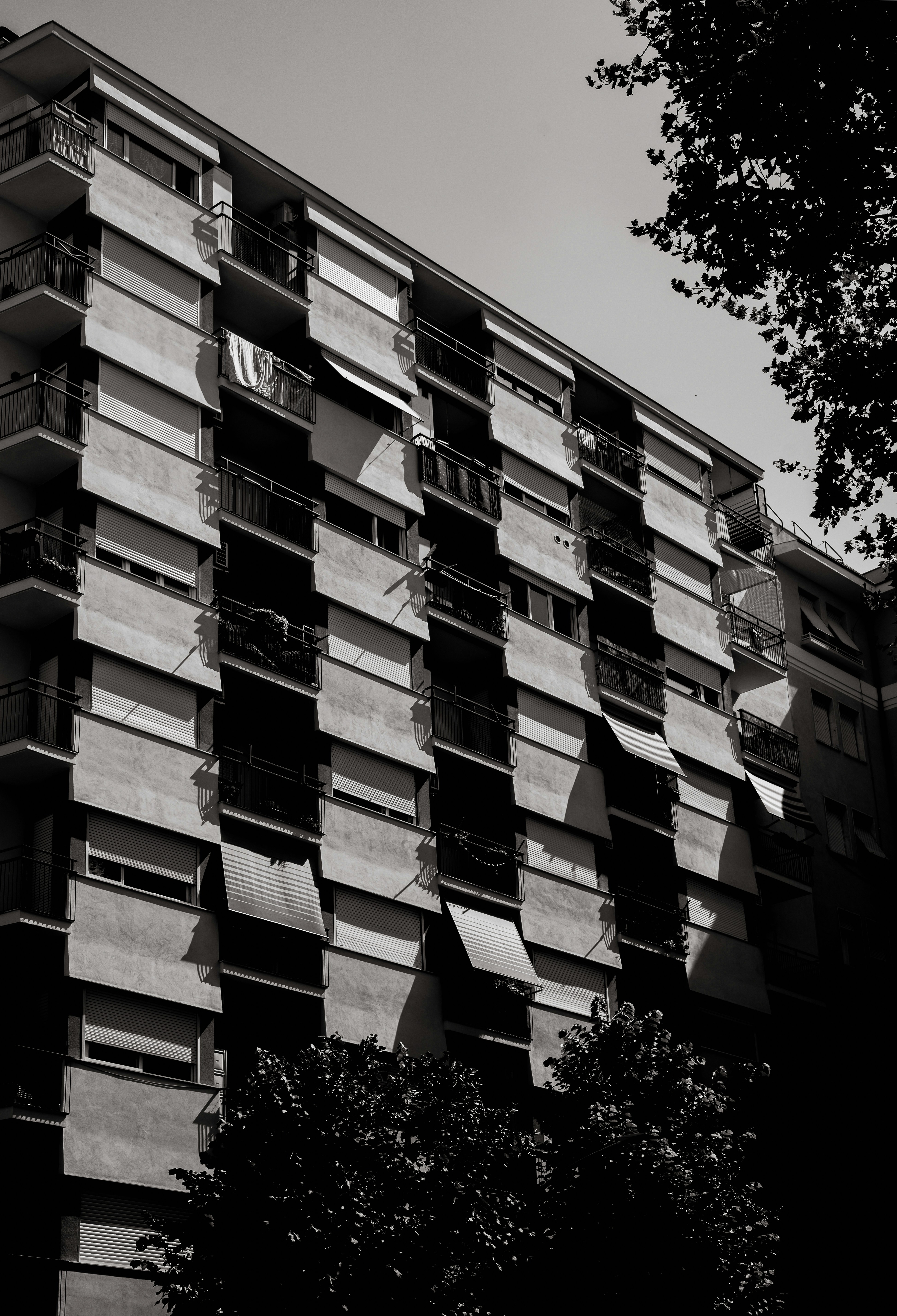 a tall building with balconies on the side of it