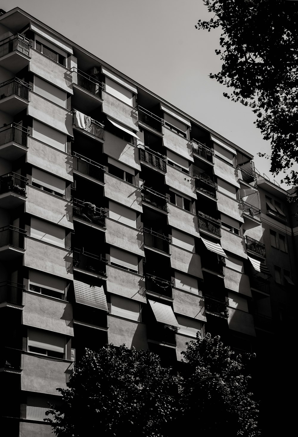 a tall building with balconies on the side of it