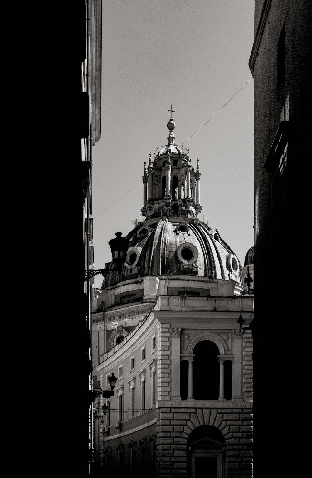 a black and white photo of a building with a dome