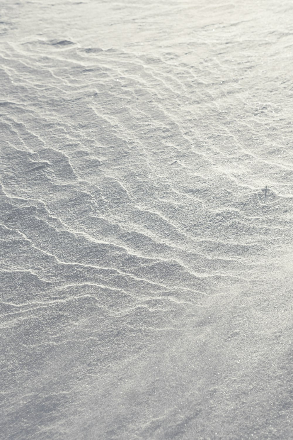 a person riding skis down a snow covered slope