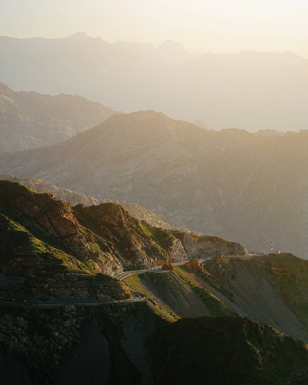 a view of a mountain with a road going through it