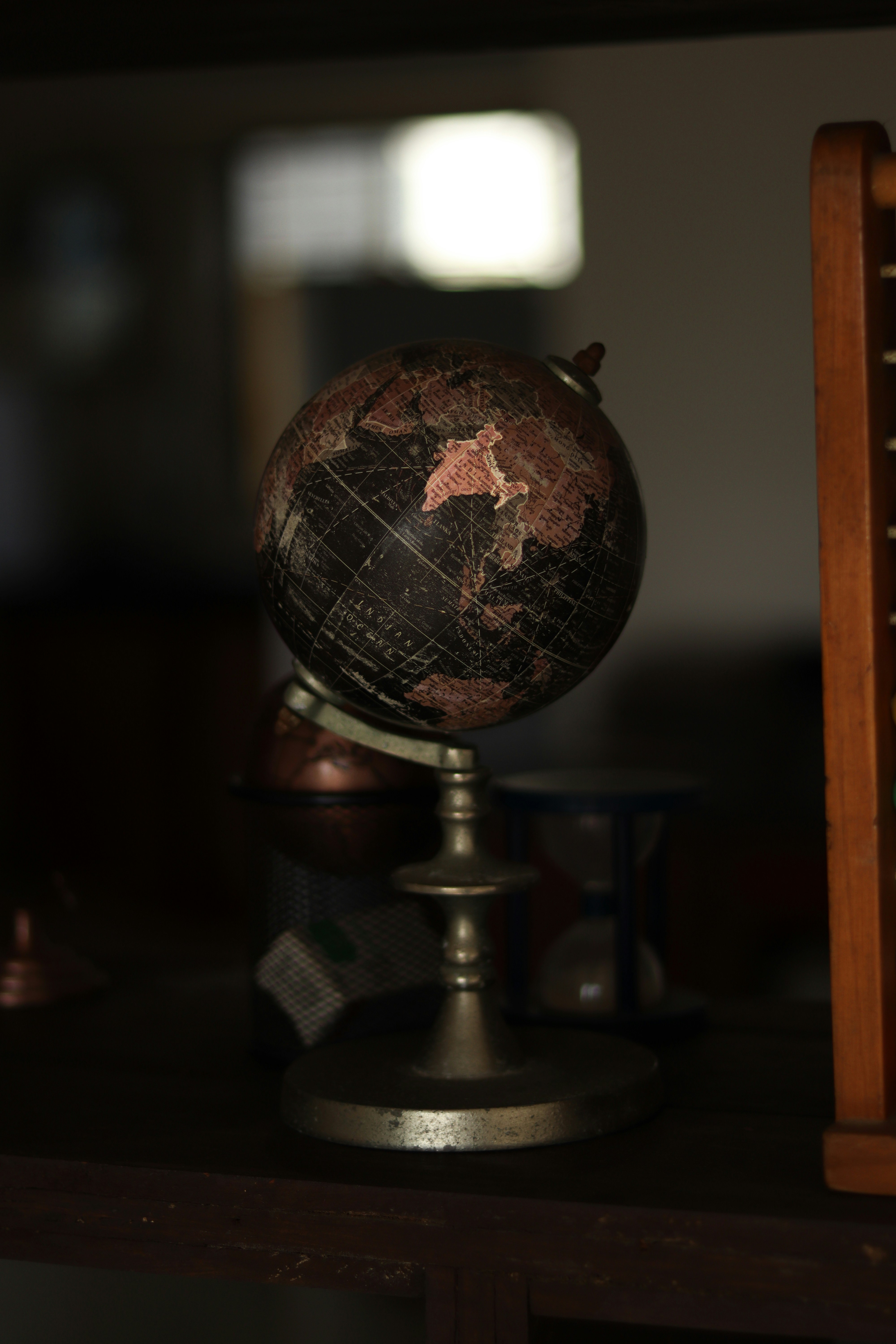 a small globe sitting on top of a wooden table