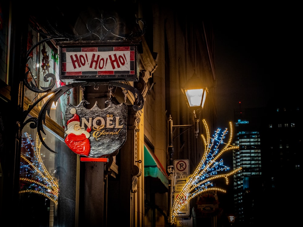 a sign that is hanging from the side of a building