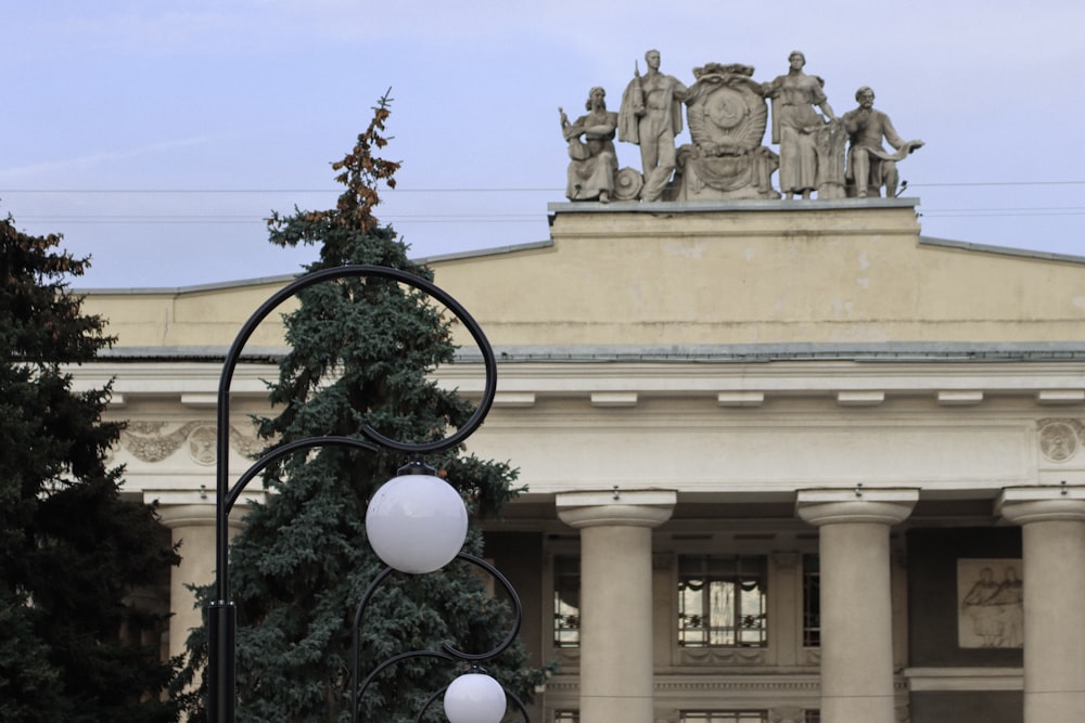 a large building with statues on top of it