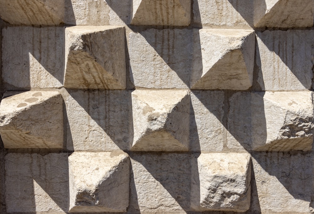 a close up of a wall made of cement blocks