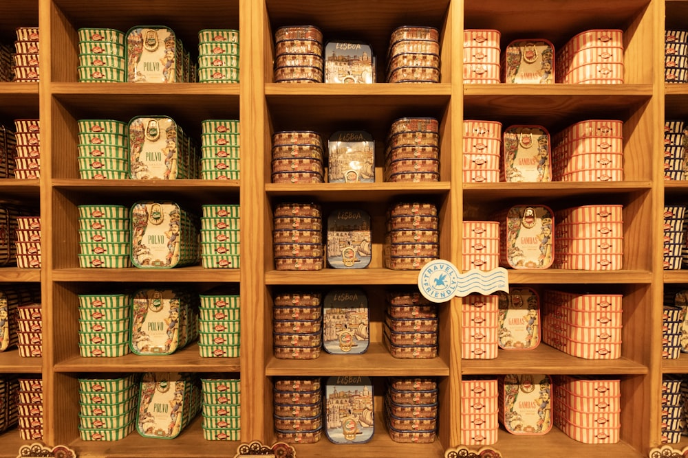 a wooden shelf filled with lots of boxes