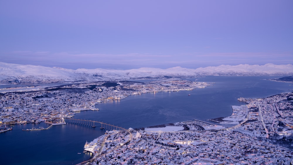 an aerial view of a city and a body of water