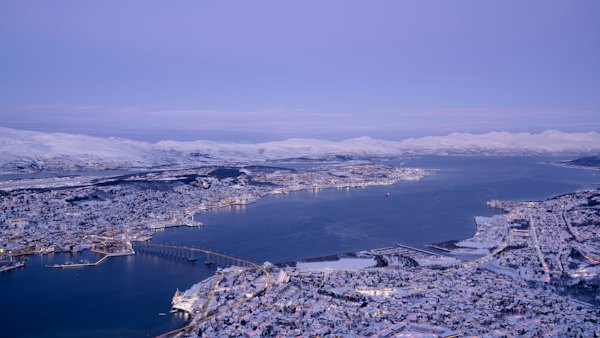 An aerial view of a city and a body of water — Tromsø, Norway