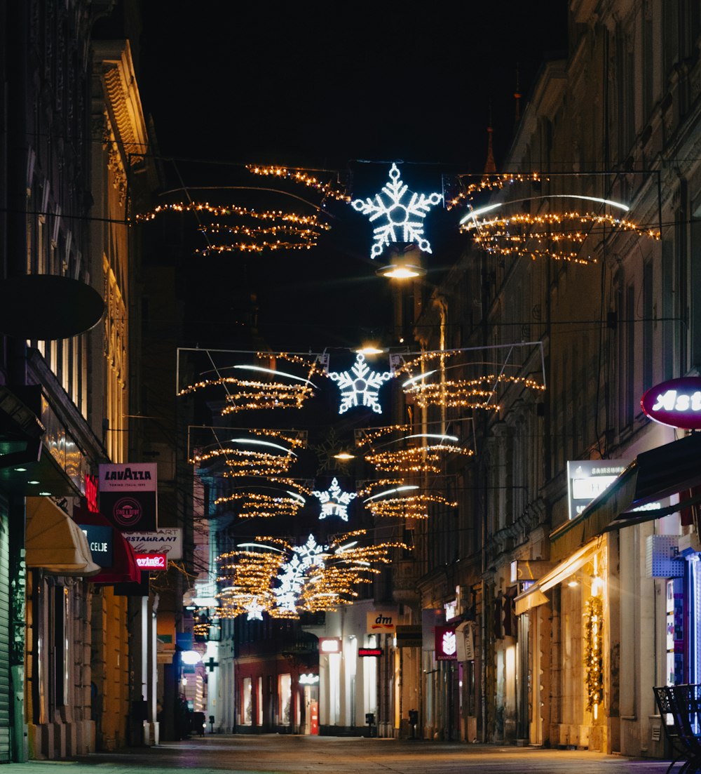 a city street filled with lots of christmas lights