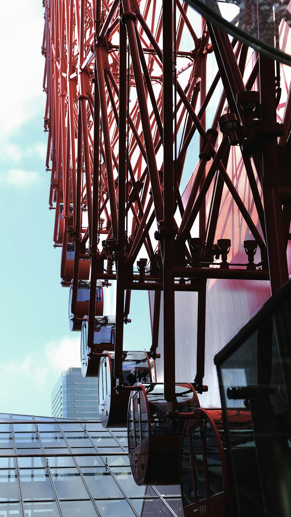 a tall red structure with a sky background