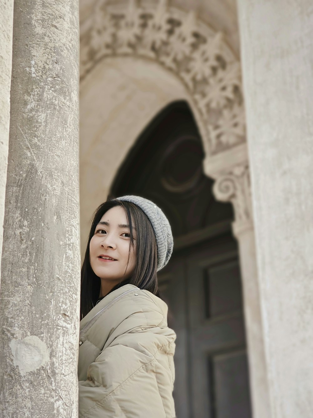 a woman standing in front of a building