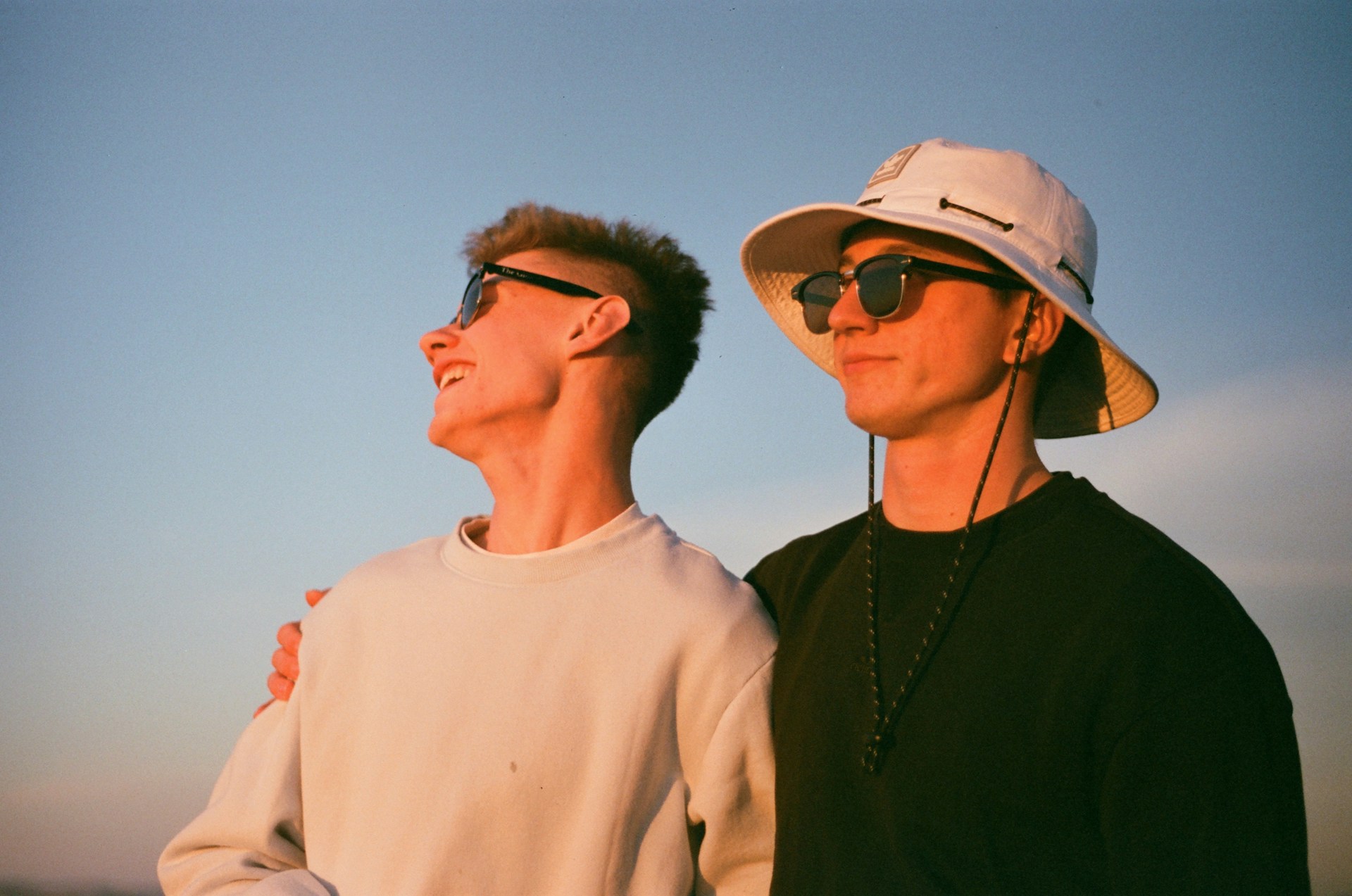 a couple of men standing next to each other