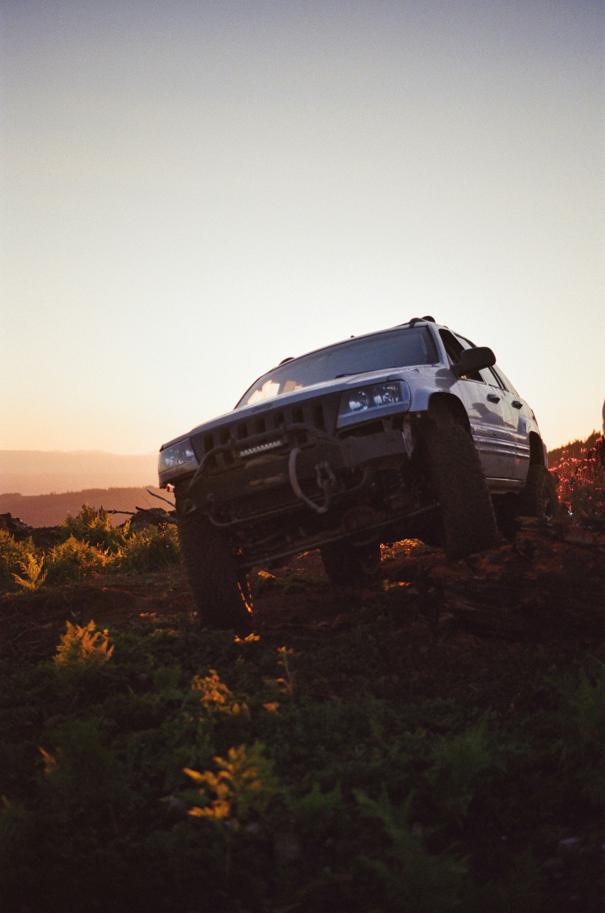 a truck that is sitting in the grass