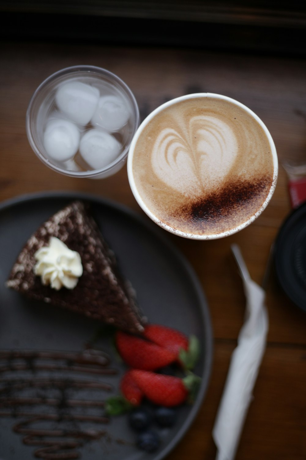 a plate with a piece of cake and a cup of coffee