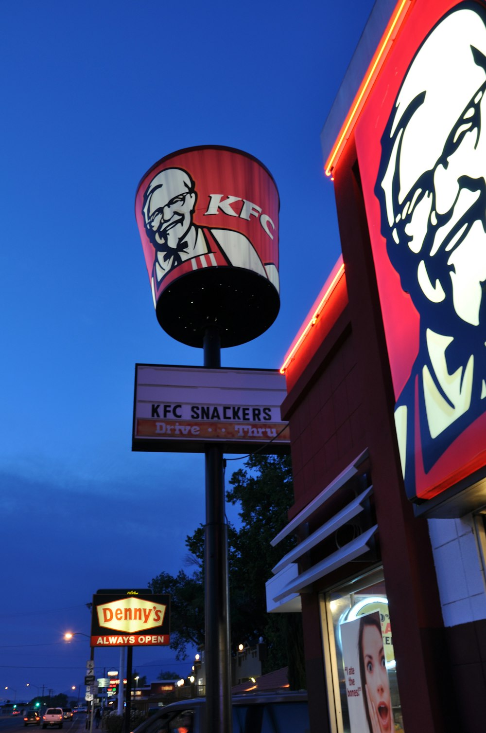 a restaurant sign with a picture of a man on it