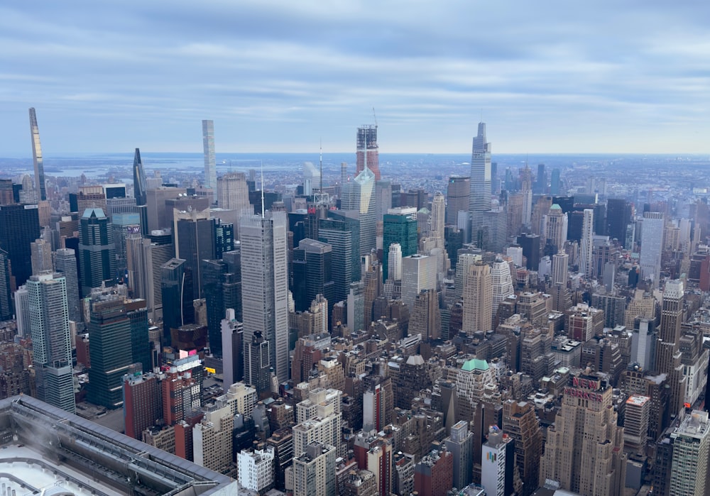 an aerial view of a city with tall buildings