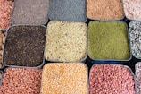 a variety of beans and cereals in trays