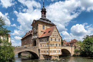 an old building with a bridge in front of it