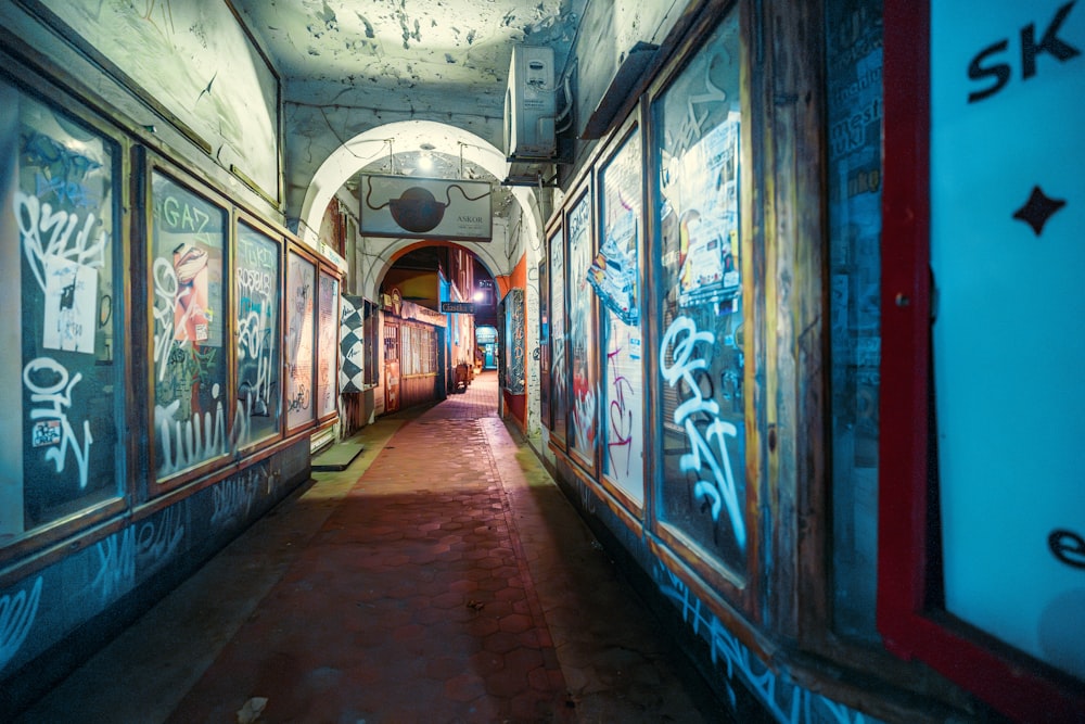 a hallway with graffiti all over the walls