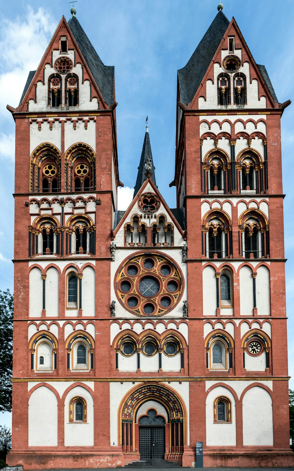 a very tall building with a clock on it's side