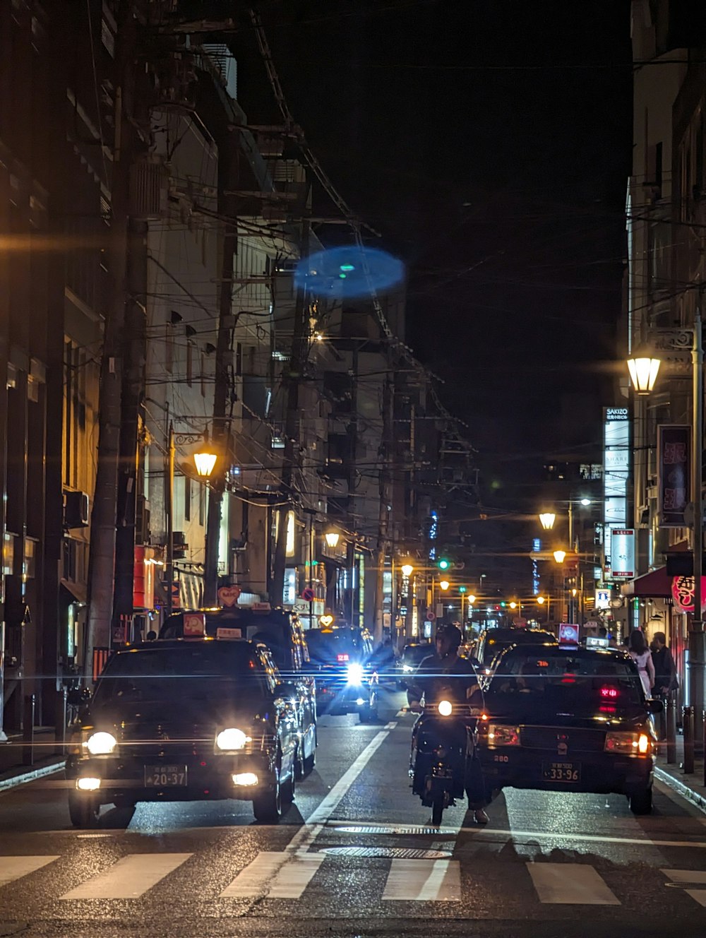 a couple of cars that are sitting in the street