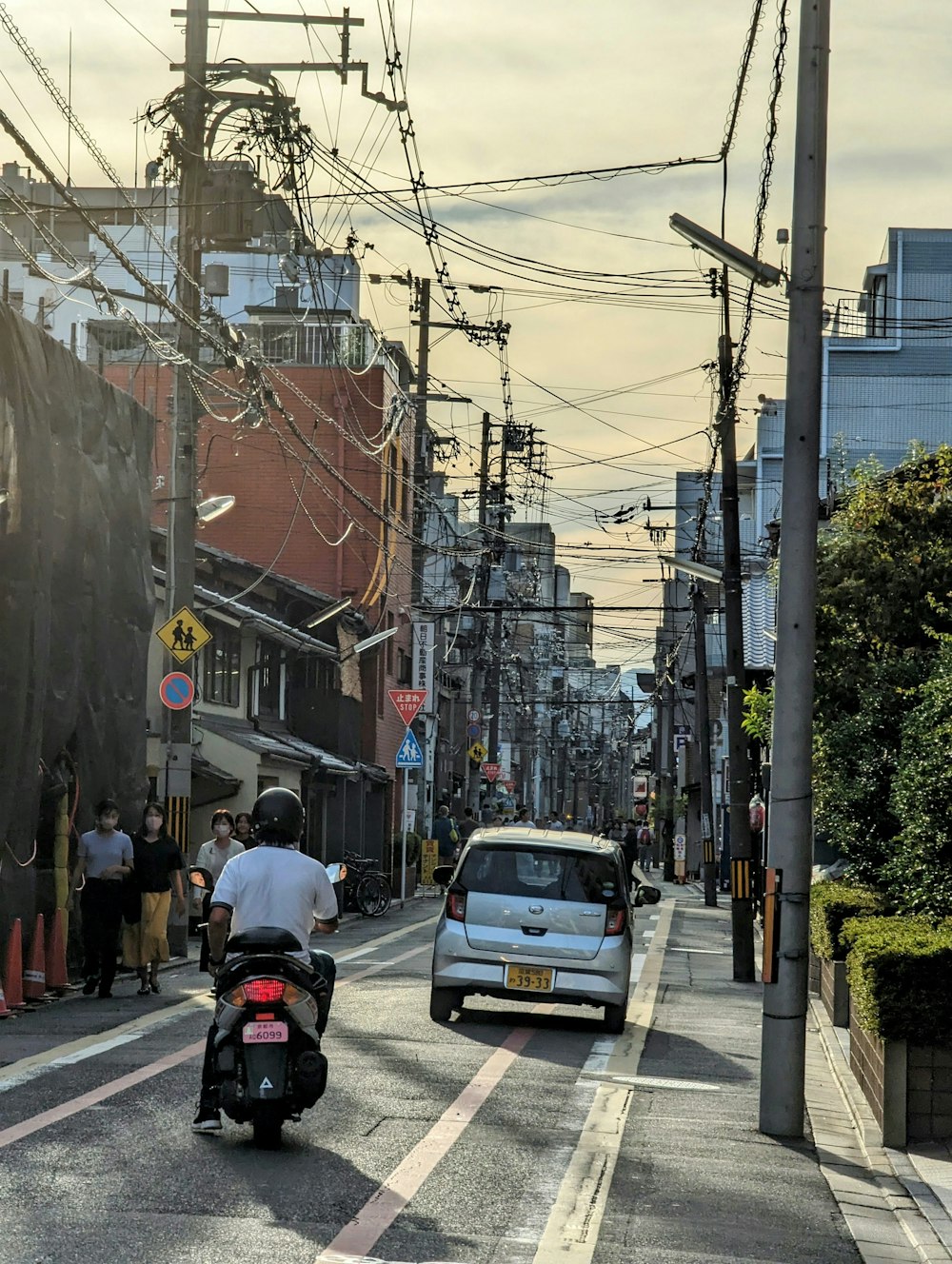 a person riding a motorcycle on a city street